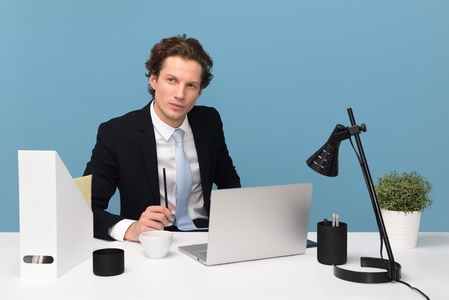 real estate agent thinking at desk